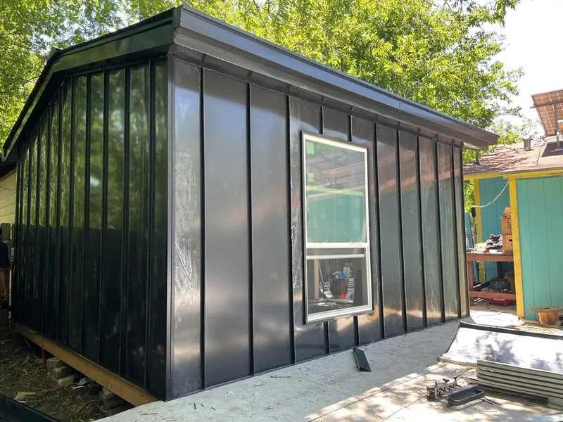 Black standing seam metal wall panels for Metal Roof Installation in Champlin