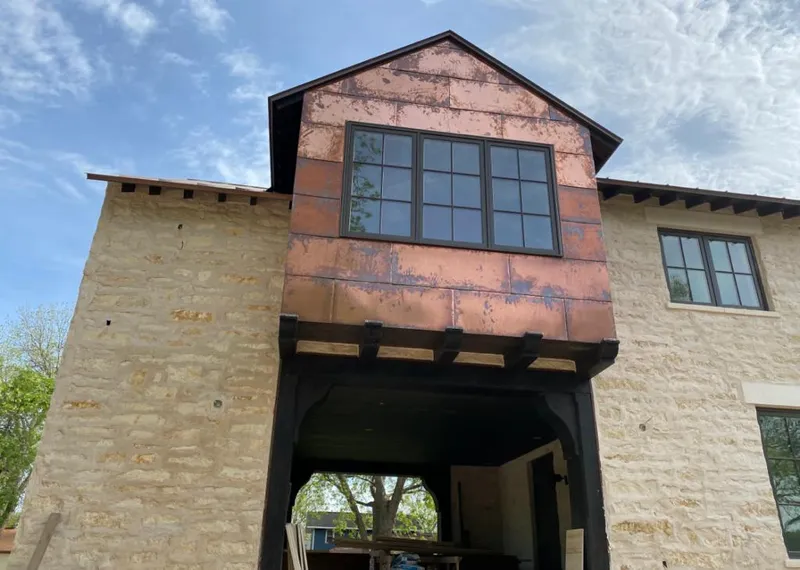 Copper metal panel facade on a stone building for Metal Roof Coating in Champlin